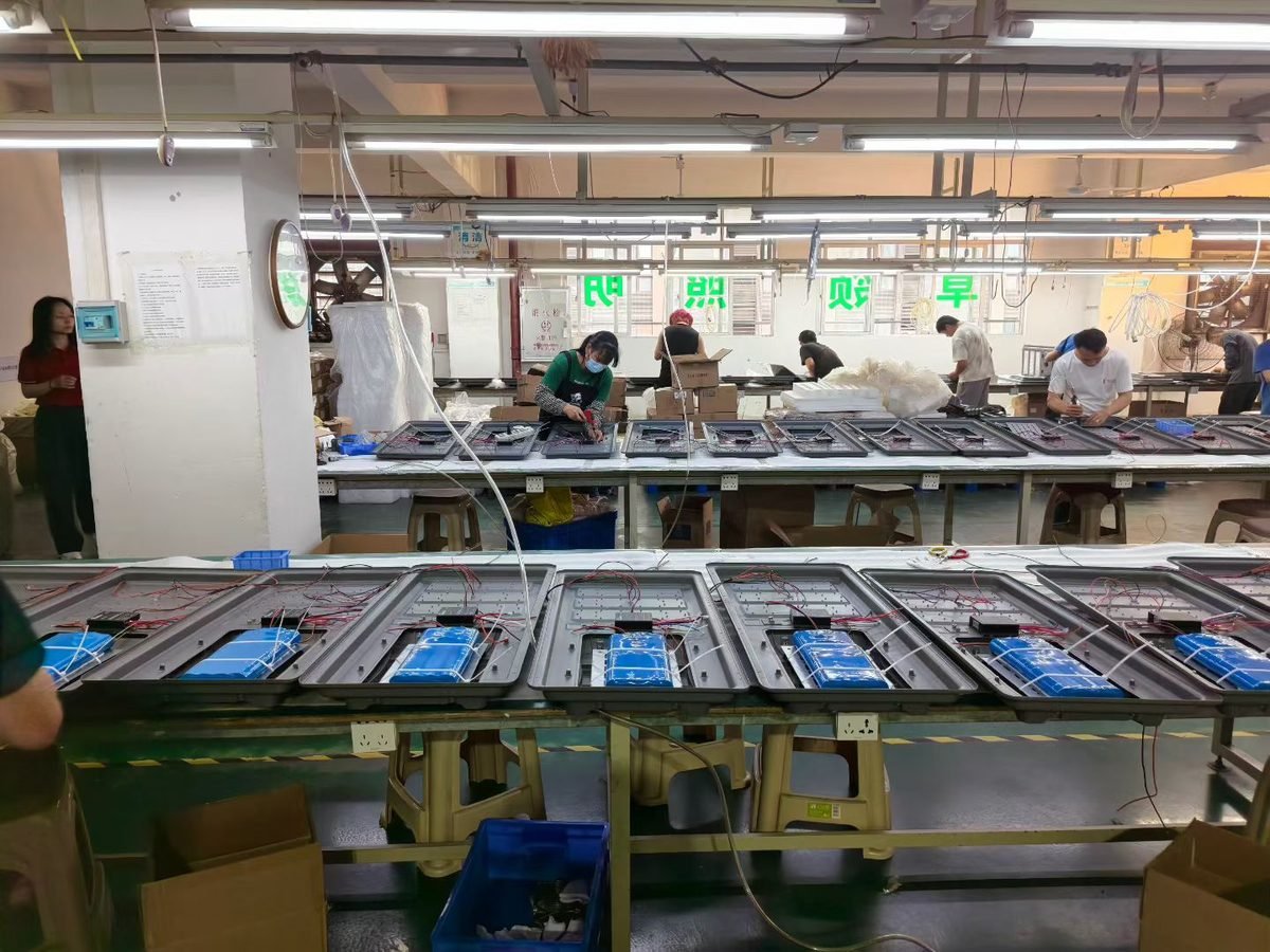 Solar street light assembly line with LiFePO4 battery installation — Solarens factory